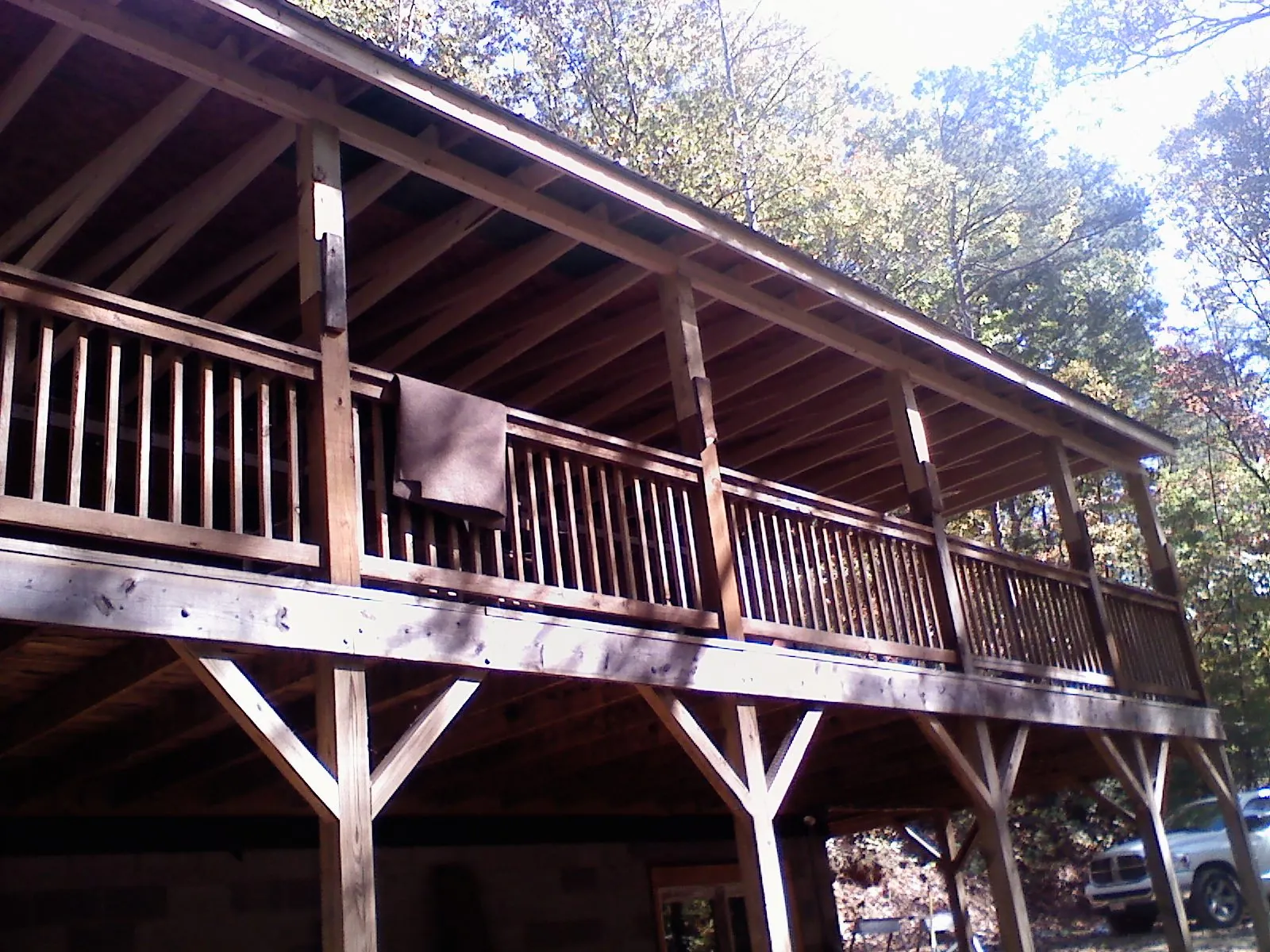 Timber framing under a new elevated porch and deck — Roof Leak Repair in Milford Square by Roofing Brothers